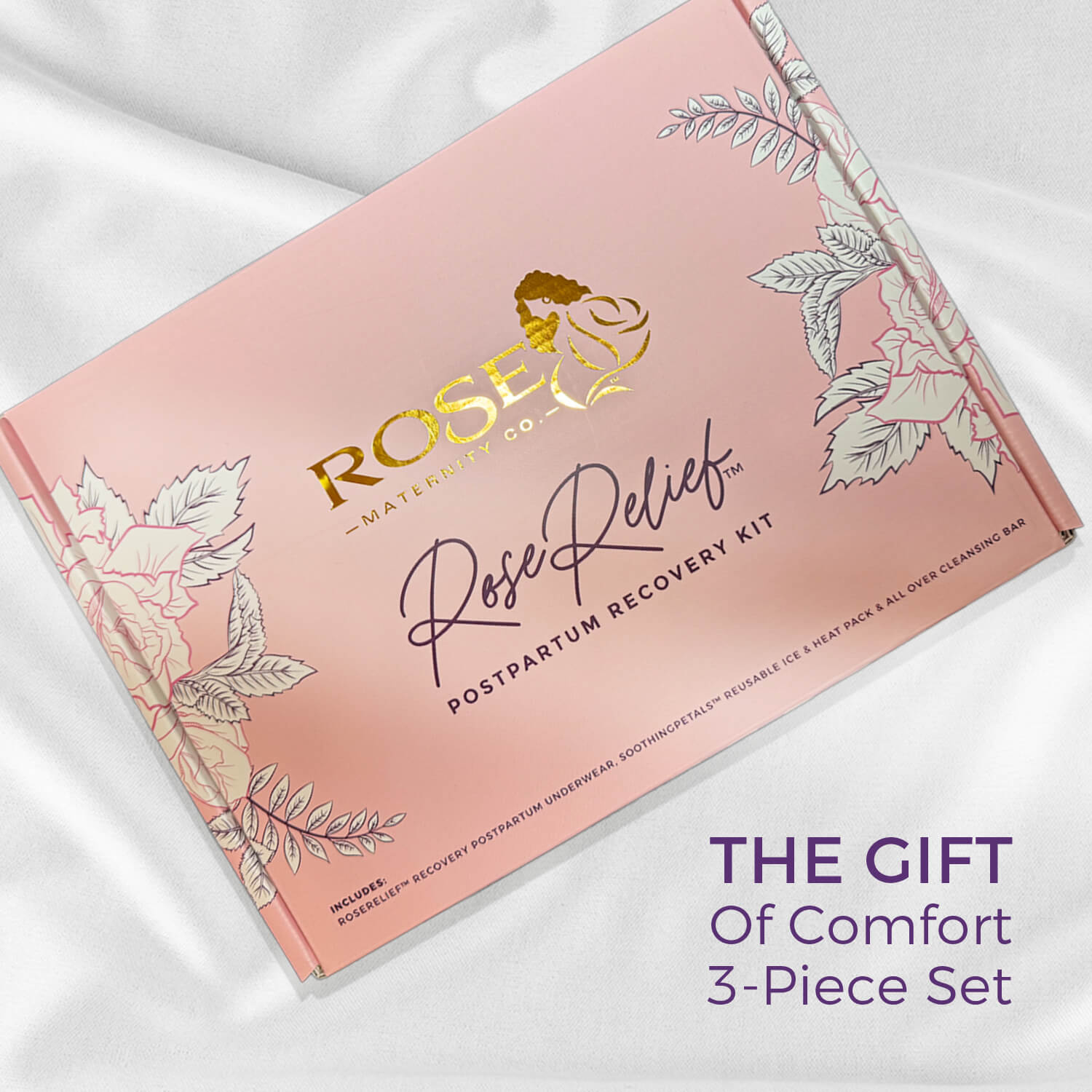 Lifestyle image of a postpartum recovery essentials gift set packaged in a box by Rose Maternity Co., including recovery underwear, an ice and heat gel pack, and self care item.