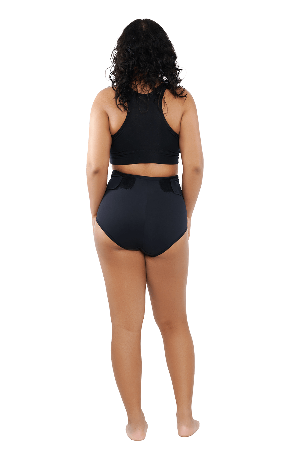 Posterior view full body lifestyle image of a woman wearing RoseRelief™ Postpartum Recovery Undergarment by Rose Maternity Co., designed for supportive and comfortable postpartum recovery.