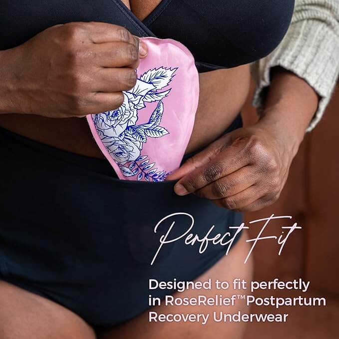 Lifestyle image of a woman inserting the SoothingPetals™ Ice and Heat Pack into the front panel of the RoseRelief™ Postpartum Recovery Undergarment by Rose Maternity Co.